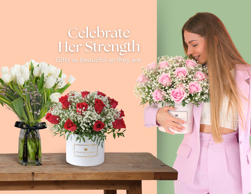 Woman holding pink rose hatbox with red rose hatbox and white tulip vase arrangement by Bloom Magic for International Women's Day