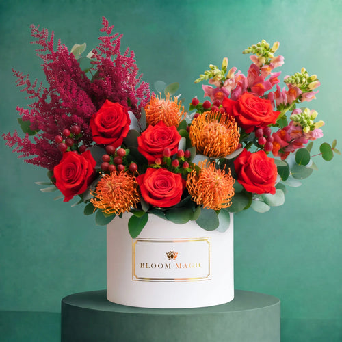 Large Scarlet Veil autumn hatbox of orange roses, nutan, red berries and eucalyptus, Bloom Magic