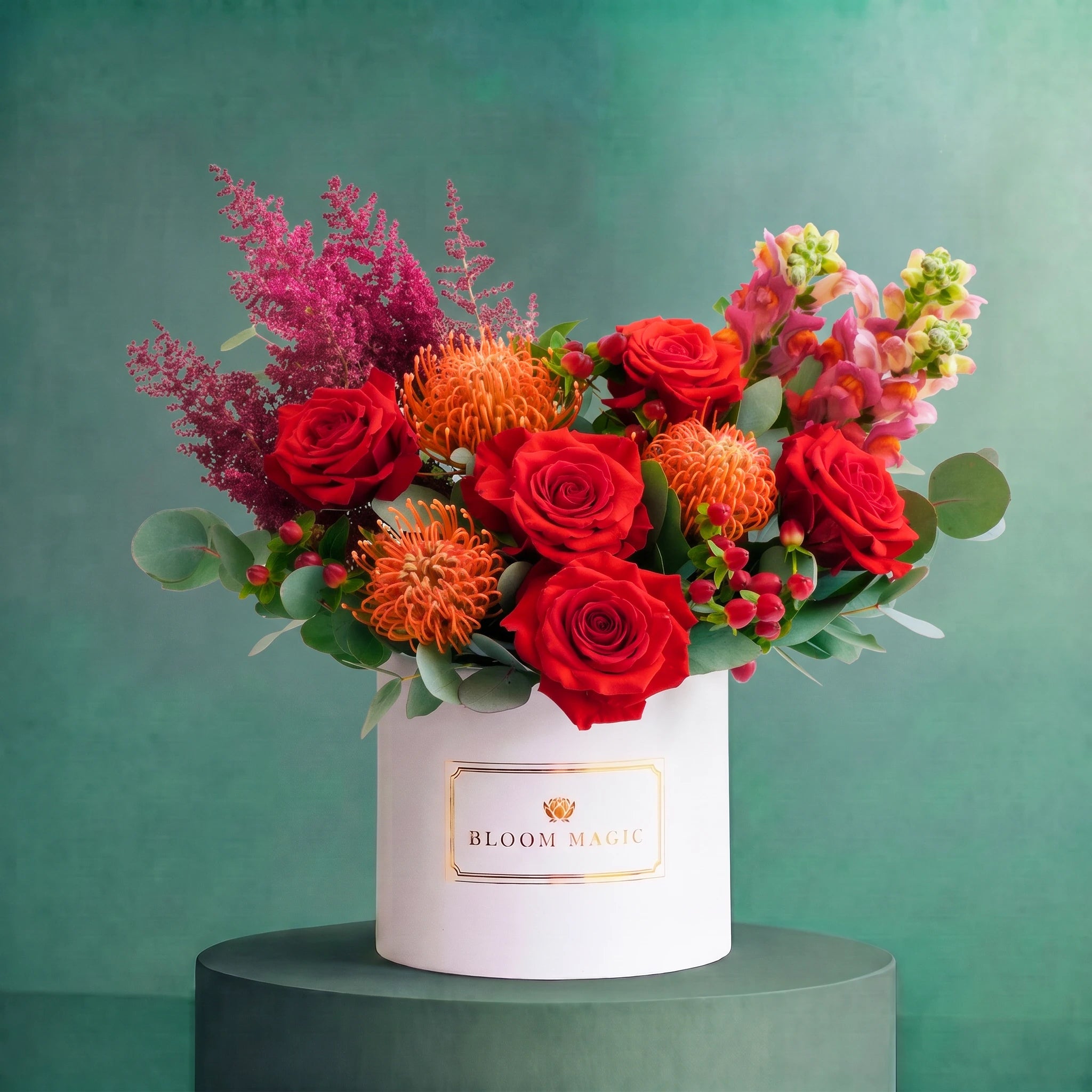Scarlet Veil autumn hatbox of orange roses, nutan, red berries and eucalyptus, Bloom Magic